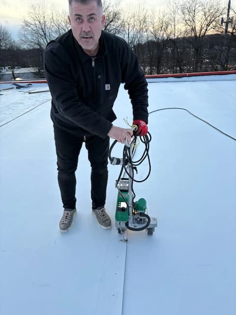 Heat Welding - TPO roofing installation process step by Genc Construction in NJ & NY